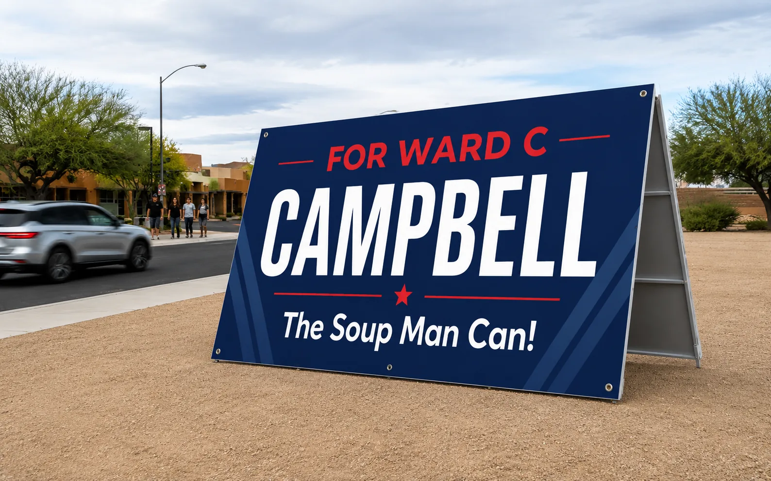 Campbell political campaign A-frame sign beside a roadway