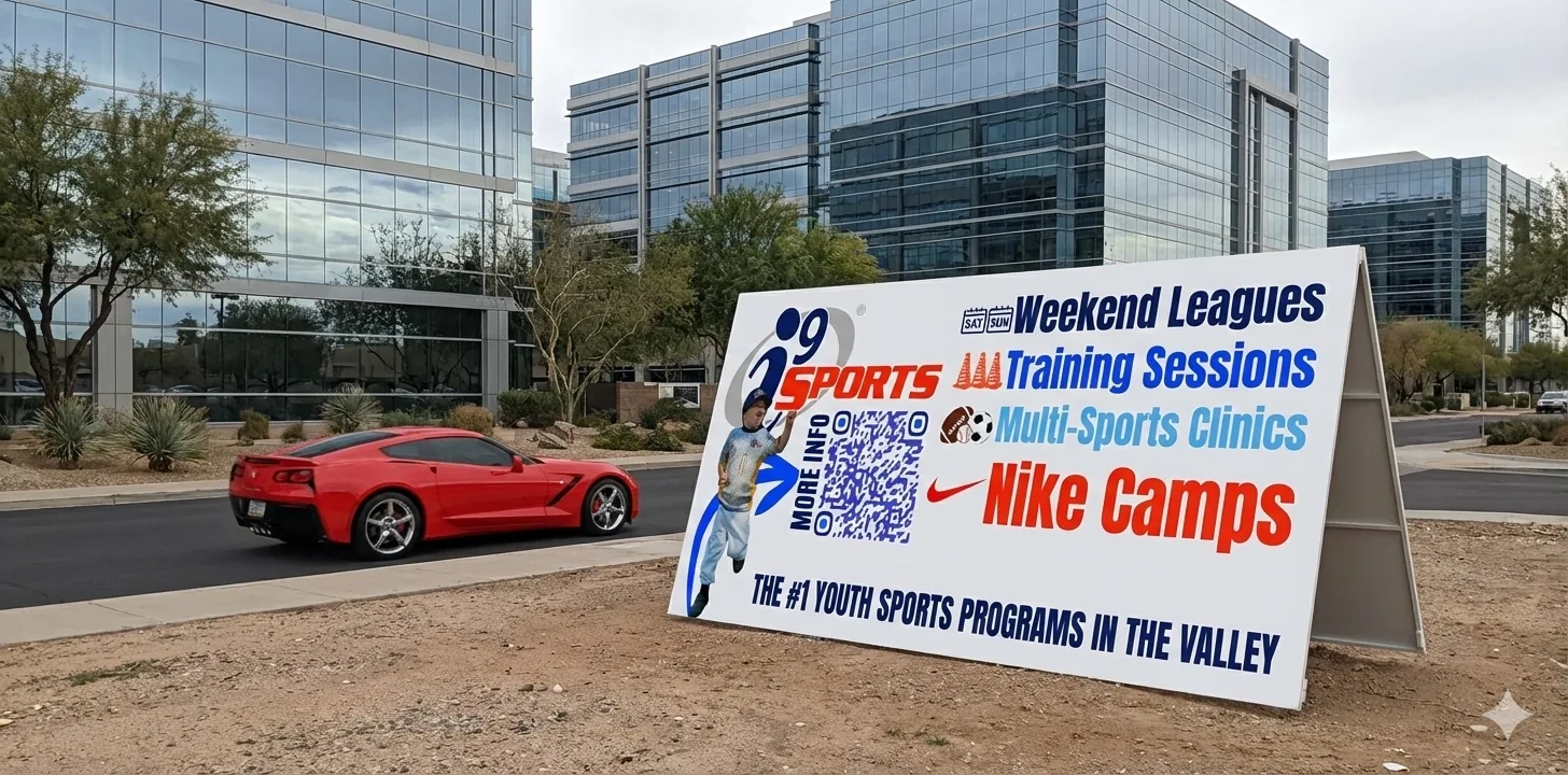 Community sports announcement A-frame sign beside an office roadway